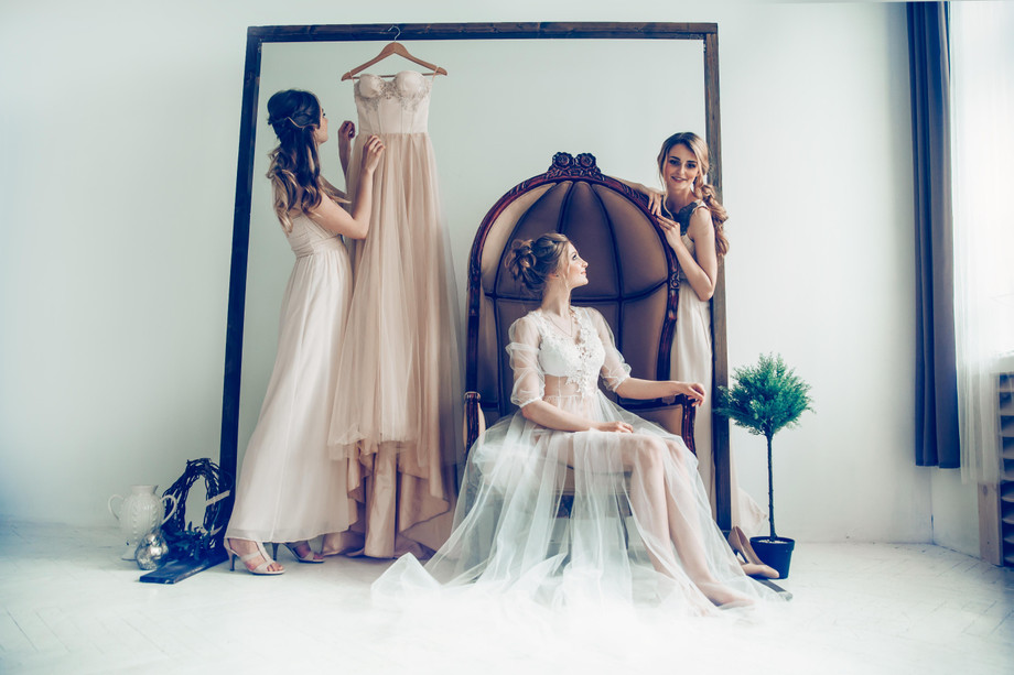 girlfriendsdressingupbridebeforeweddingceremonyholidaysevents.jpg