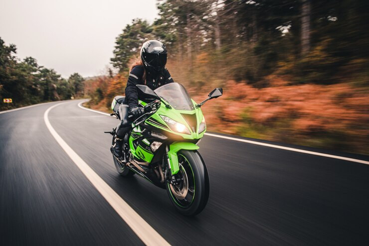 drivinggreenneoncolormotorcycleroad_1145795031.jpg
