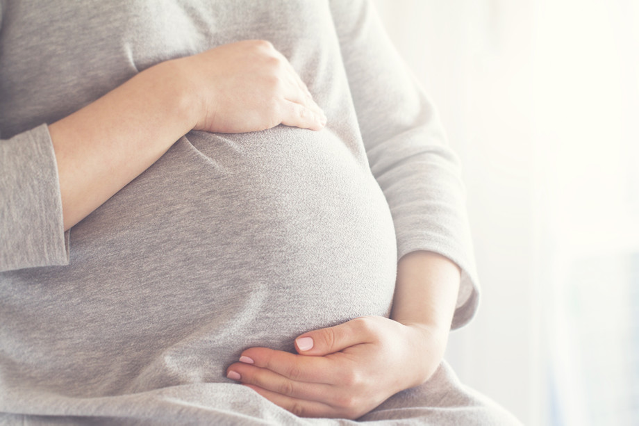 pregnantwomantouchingherbelly.jpg