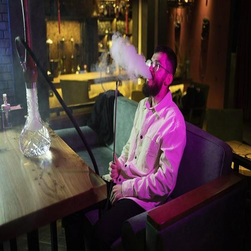 manrelaxingbyvapingfromhookahbar.jpg