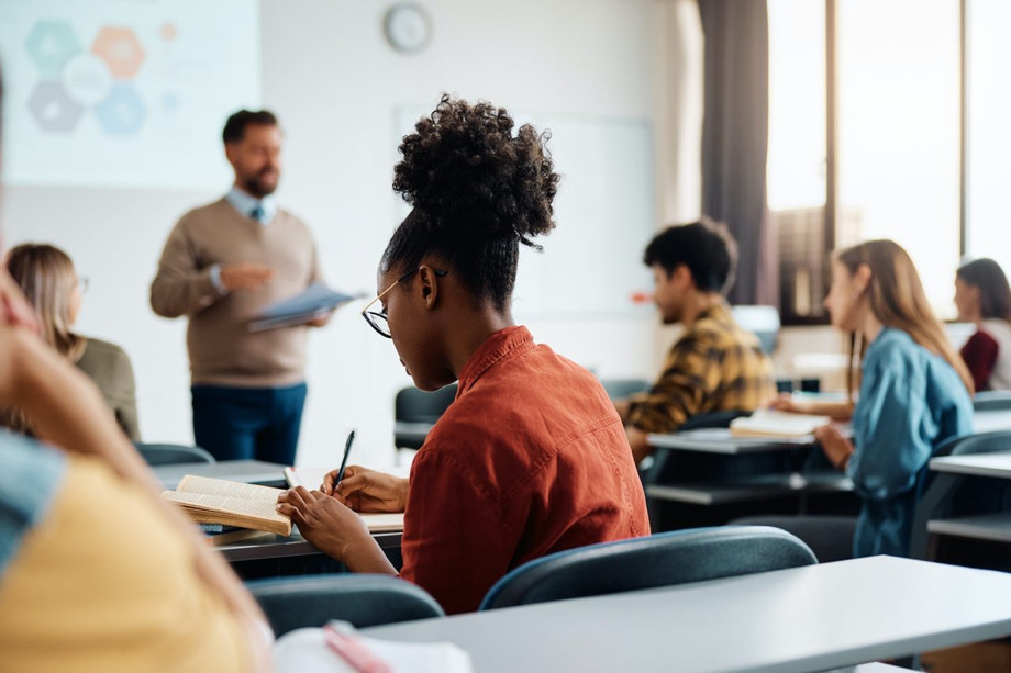 blackfemalestudenttakingnotesduringaclassinlecturehall.jpg
