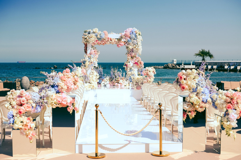 wonderfulweddingceremonyplacenearseadecoratedbyflowers1.jpg