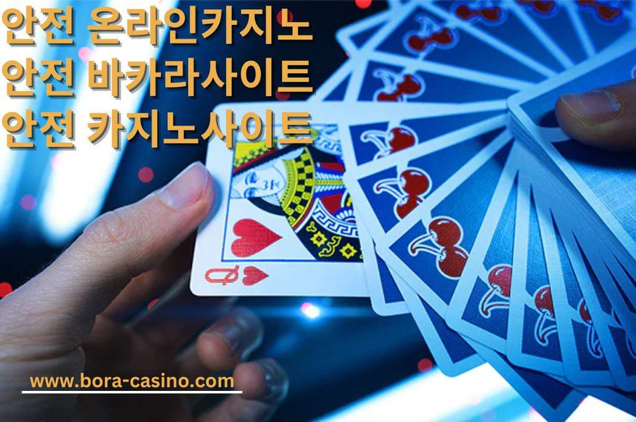 Blue cherry cards hold by a player of casino