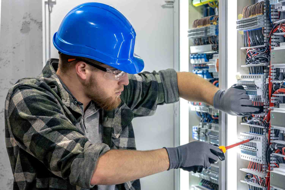 electricianconnectingwiresworkinsidepanelengineerwithtool1.jpg