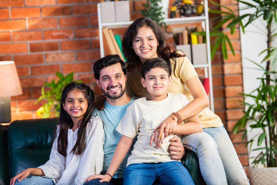 imgi_23_cheerfulindianparentsandkidssittingontheso20240905220519utcscaled1.jpeg