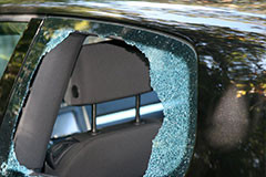 back_window_glass_of_black_sedan_is_broken_from_thief_smashed_it_in.jpg