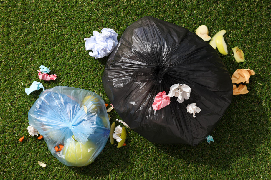 garbagebagswithrubbishgreenbackgroundtopview1.jpg