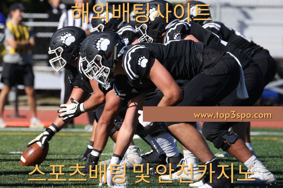 Football black team in position ready to start the game.