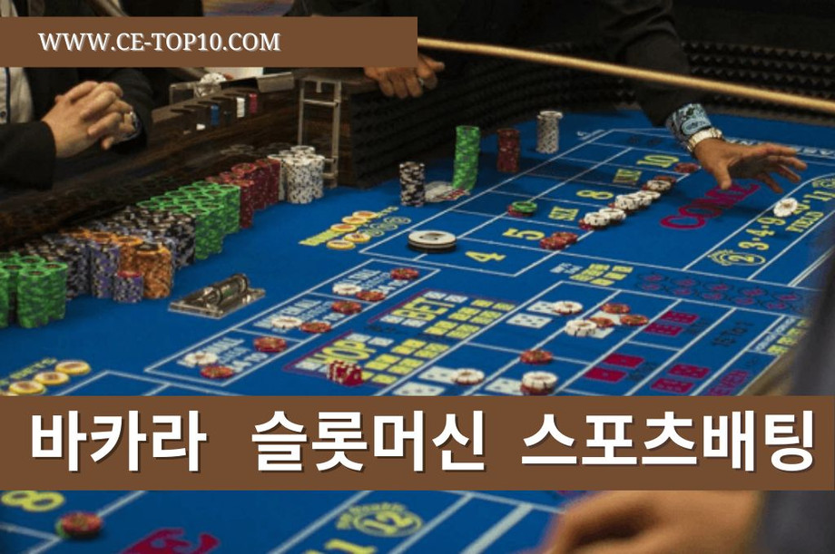 Blue craps table surrounded by a lot of casino players.