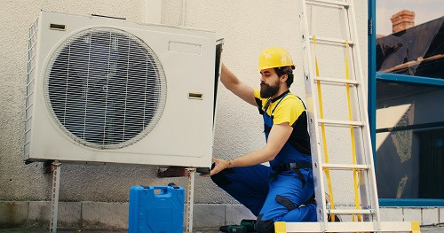 workerworksairconditioner.jpg