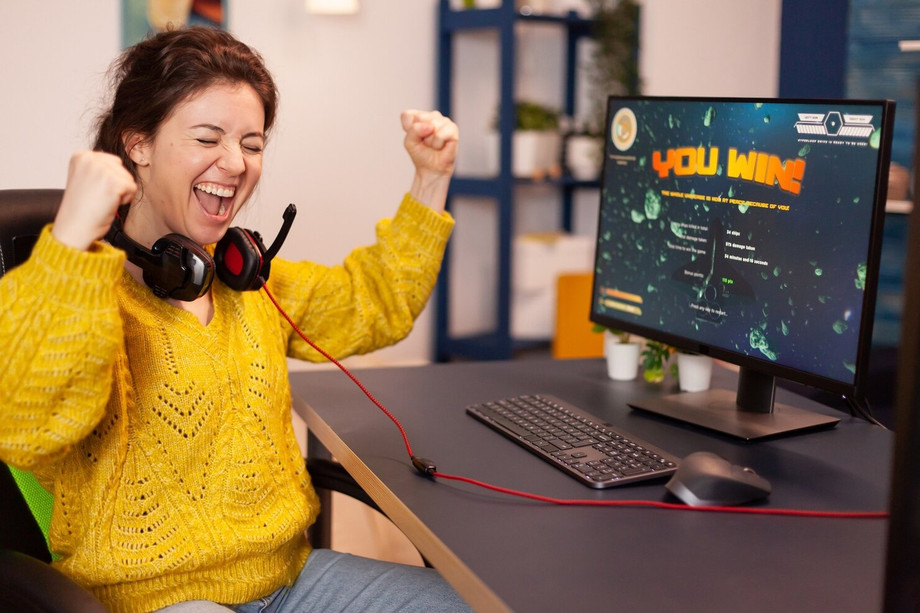 imgi_29_joyfulplayercelebratesvictorywinningspaceshooteronlinevideogamepowerfulpersonalcomputer_4822572061.jpeg